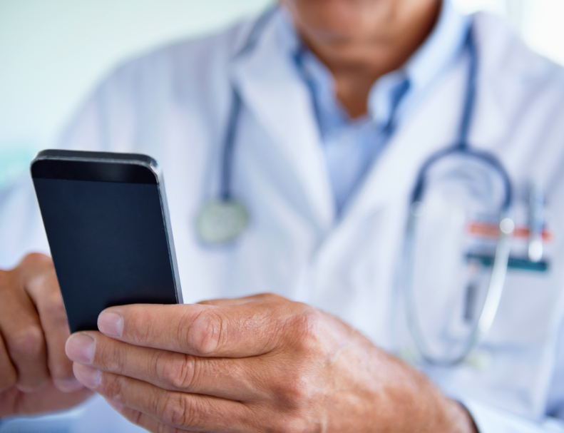 Doctor using mobile phone